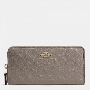 Famous Brand Coach Accordion Zip Wallet In Signature Embossed Leather